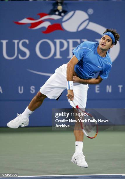 Roger Federer serves the ball during his third-round 2006 U.S. Open match against Vincent Spadea at Louis Armstrong Stadium in Flushing...