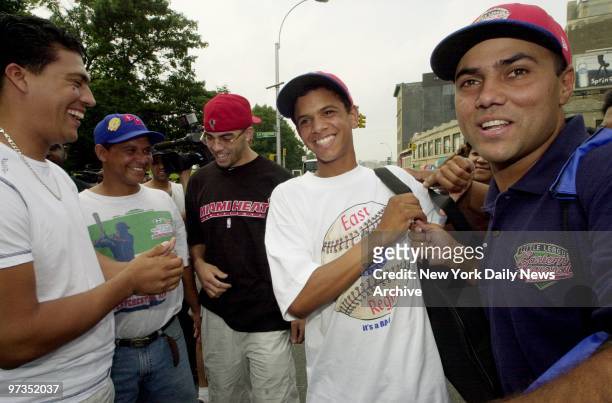 Rolando Paulino All-Stars' ace pitcher Danny Almonte and coach Alberto Gonzalez bask in the praise of fans as they are welcomed home at E. Tremont...