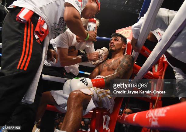 Abner Mares sits in his corner as he was defeated by Leo Santa Cruz in their WBA Featherweight Title & WBC Diamond Title fight at Staples Center on...