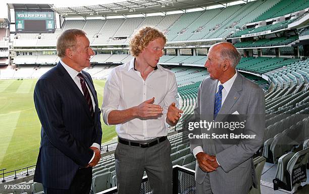 President of Athletics Australia Rob Fildes, athlete Steve Hooker and former athlete John Landy chat during the John Landy lunch club media...