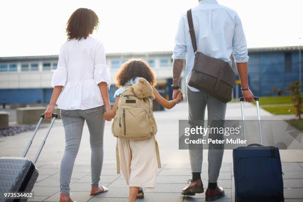 family of three going on vacation - travel bag stock pictures, royalty-free photos & images
