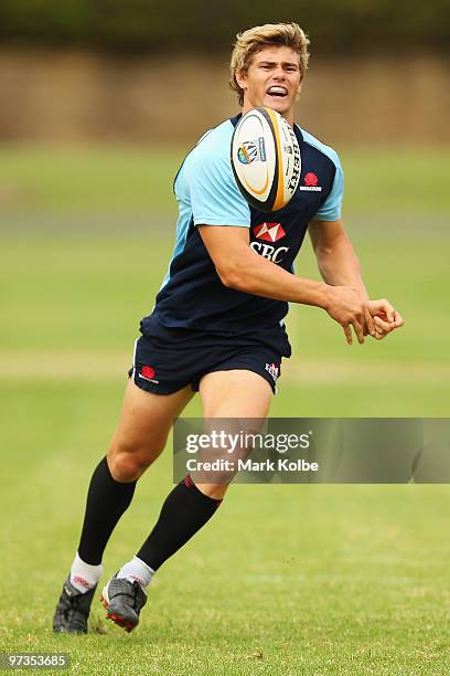 Berrick Barnes passes during a Waratahs Super 14 training session at Victoria Barracks on March 2, 2010 in Sydney, Australia.