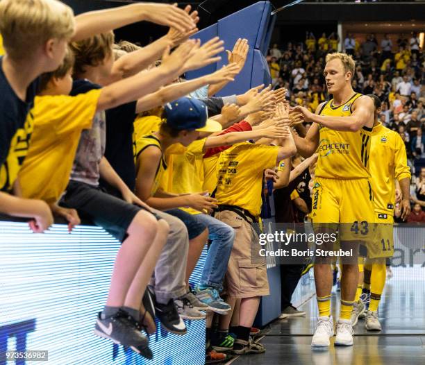 Luke Sikma of ALBA Berlin celebrates after winning the the fourth play-off game of the German Basketball Bundesliga finals at Mercedes-Benz Arena on...