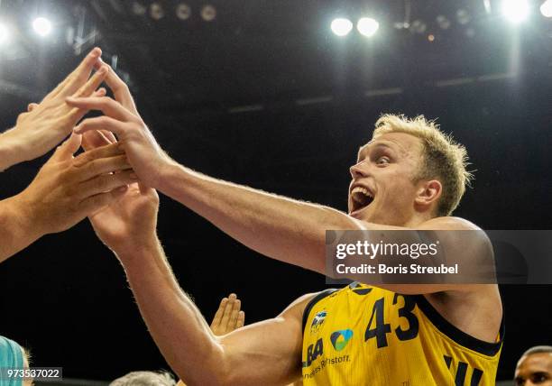 Luke Sikma of ALBA Berlin celebrates after winning the fourth play-off game of the German Basketball Bundesliga finals at Mercedes-Benz Arena on June...