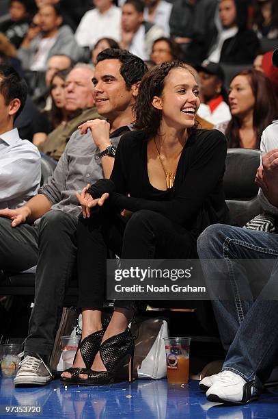 Producer Cash Warren and wife Jessica Alba attend a game between the Utah Jazz and the Los Angeles Clippers at Staples Center on March 1, 2010 in Los...