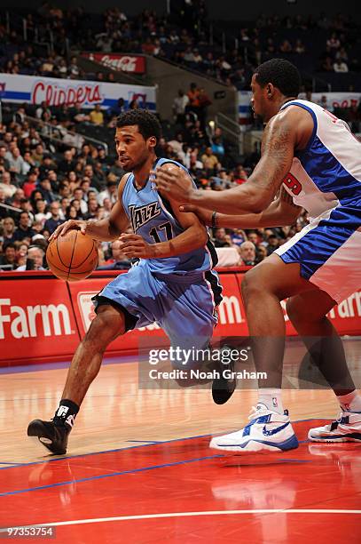 Ronnie Price of the Utah Jazz drives against DeAndre Jordan of the Los Angeles Clippers at Staples Center on March 1, 2010 in Los Angeles,...