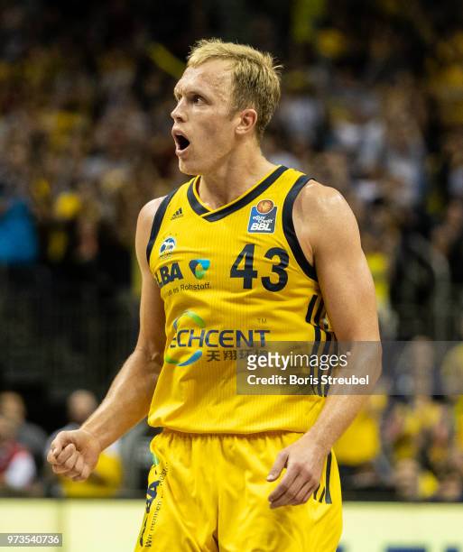 Luke Sikma of ALBA Berlin celebrates during the fourth play-off game of the German Basketball Bundesliga finals at Mercedes-Benz Arena on June 13,...