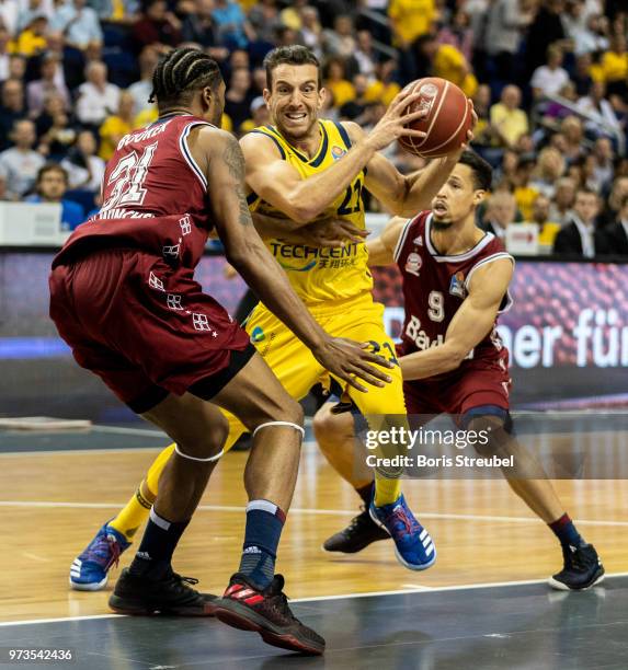 Spencer Butterfield of ALBA Berlin competes with Devin Booker Bayern Muenchen during the fourth play-off game of the German Basketball Bundesliga...