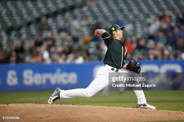 Daniel Gossett of the Oakland Athletics pitches during the game against the Seattle Mariners at the Oakland Alameda Coliseum on May 23, 2018 in...