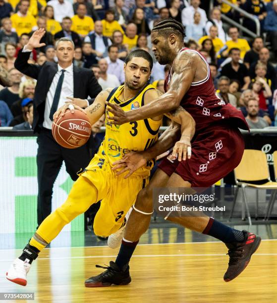 Peyton Siva of ALBA Berlin competes with Devin Booker Bayern Muenchen during the fourth play-off game of the German Basketball Bundesliga finals at...