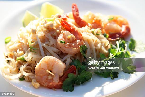 pad thai noodle and shrimp dish - lori andrews stock pictures, royalty-free photos & images