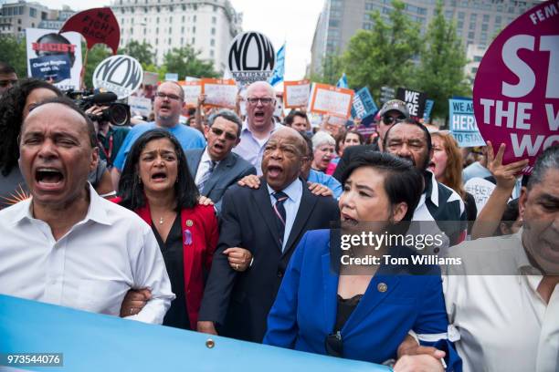 From left, Reps. Luis Gutierrez, D-Ill., Pramila Jayapal, D-Wash., John Lewis, D-Ga., Judy Chu, D-Calif., Al Green, D-Texas, Adriano Espaillat,...