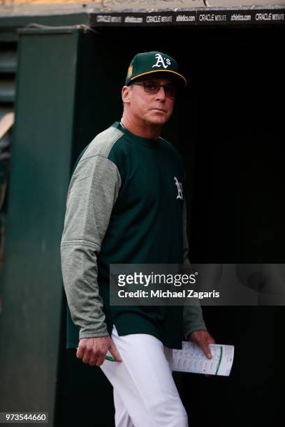 Manager Bob Melvin of the Oakland Athletics stands in the dugout during the game against the Seattle Mariners at the Oakland Alameda Coliseum on May...