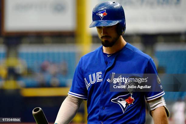 Randal Grichuk of the Toronto Blue Jays walks off the field after striking out in the ninth inning against the Tampa Bay Rays on June 13, 2018 at...