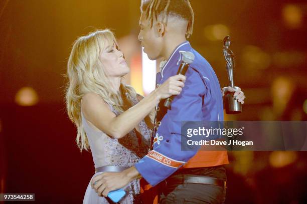 Amanda Holden presents the PPL Classic BRITs Breakthrough Artist of the Year award to winner Tokio Myers during the 2018 Classic BRIT Awards held at...