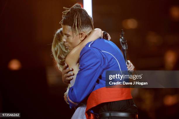 Amanda Holden presents the PPL Classic BRITs Breakthrough Artist of the Year award to winner Tokio Myers during the 2018 Classic BRIT Awards held at...