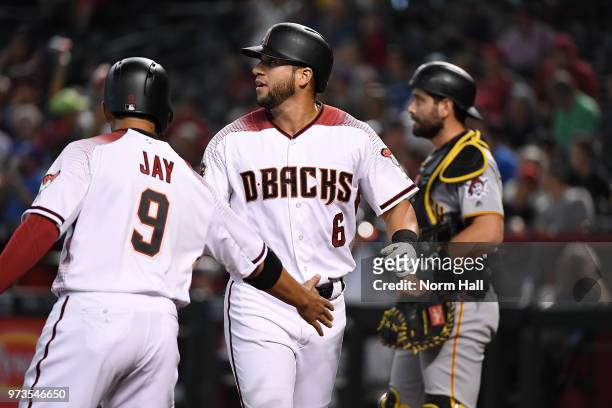 David Peralta of the Arizona Diamondbacks is congratulated by Jon Jay after hitting a two-run home run off of Jameson Taillon of the Pittsburgh...