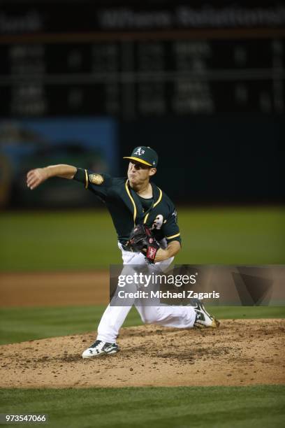 Daniel Gossett of the Oakland Athletics pitches during the game against the Seattle Mariners at the Oakland Alameda Coliseum on May 23, 2018 in...