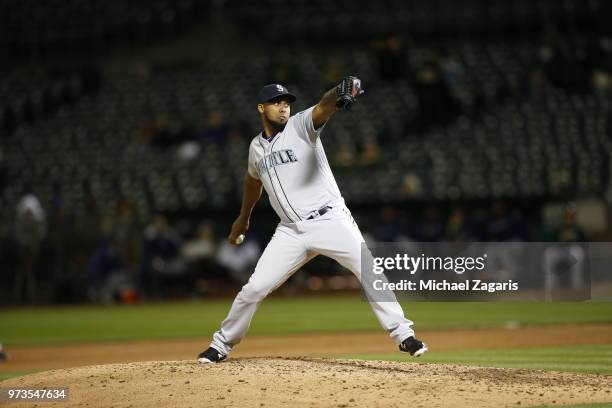 Juan Nicasio of the Seattle Mariners pitches during the game against the Oakland Athletics at the Oakland Alameda Coliseum on May 23, 2018 in...