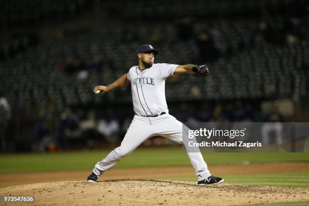 Juan Nicasio of the Seattle Mariners pitches during the game against the Oakland Athletics at the Oakland Alameda Coliseum on May 23, 2018 in...