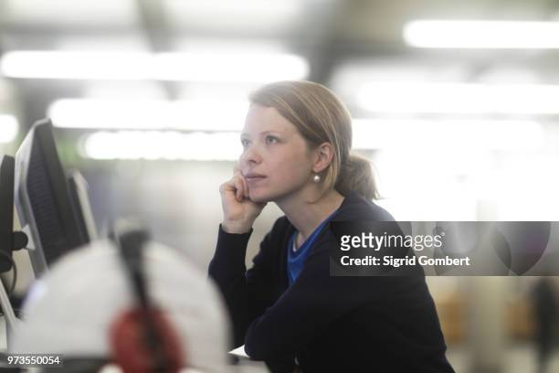 woman daydreaming in office - sigrid gombert stock pictures, royalty-free photos & images