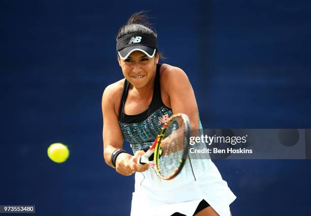 Heather Watson of Great Britain plays a backhand during her doubles match on during Day Five of the Nature Valley Open at Nottingham Tennis Centre on...