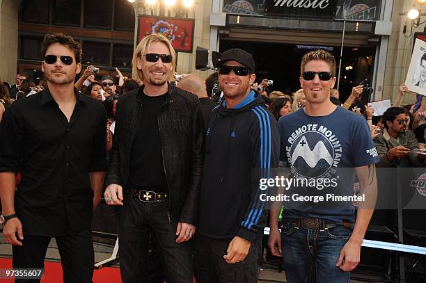 Ryan Peake, Chad Kroeger, Mike Kroeger and Daniel Adair of Nickelback arrive on the red carpet of the 20th Annual MuchMusic Video Awards at the...