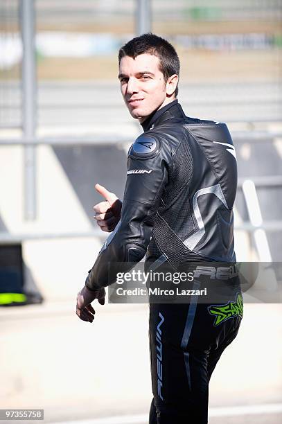 Alex De Angelis of San Marino and Scot Racing Team smiles in paddock during the first day of testing at Comunitat Valenciana Ricardo Tormo Circuit on...