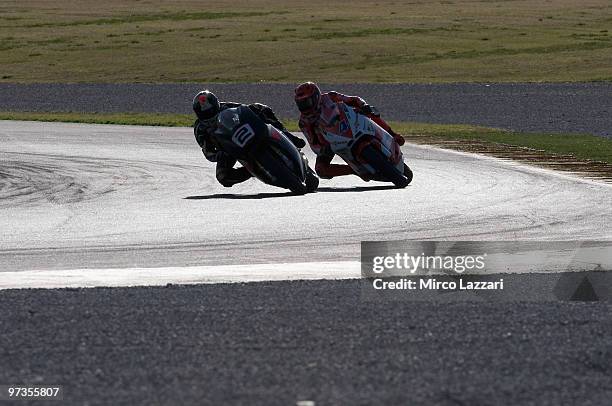 Gabor Talmacsi of Hungary and Speed Up leads Stefan Bradl of Germany and Viessmann Kiefer Racing and round the bend during the first day of testing...