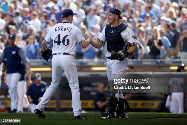 Corey Knebel and Erik Kratz of the Milwaukee Brewers celebrate after defeating the Chicago Cubs 1-0 at Miller Park on May 27, 2018 in Milwaukee,...