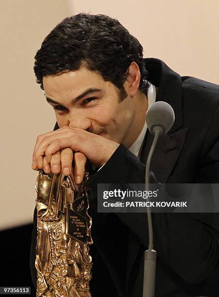 French actor Tahar Rahim reacts after he received the award of the best actor for his part in "Un prophete" during the 35th Cesars French film awards...