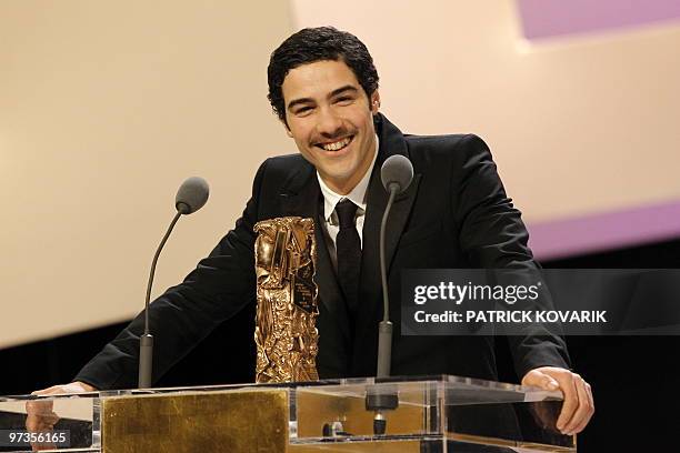 French actor Tahar Rahim waves after he received the award of the best actor for his part in "Un prophete" during the 35th Cesars French film awards...