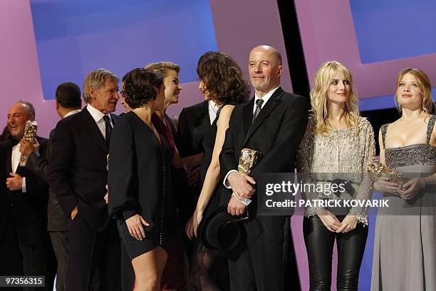 French director Jacques Audiard , French actresses Melanie Laurent and Melanie Thierry pose on stage at the end of the 35th Cesars French film awards...