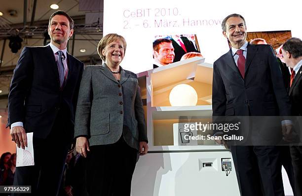 German Chancellor Angela Merkel and Spanish Prime Minister Jose Luis Rodriguez Zapatero pose after a presentation of a digitally-supervised energy...