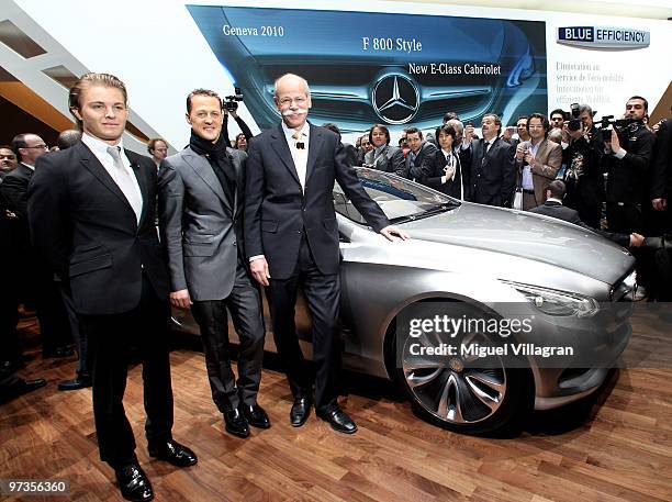 Nico Rosberg , Michael Schumacher, both of Germany and Mercedes GP, and Dieter Zetsche, chief executive officer of Daimler AG pose next to the...