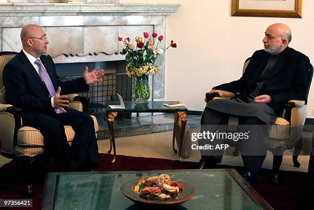 Czech Deputy Prime Minister and Minister of Defence Martin Bartak gestures as he speaks with Afghan President Hamid Karzai during a meeting at The...