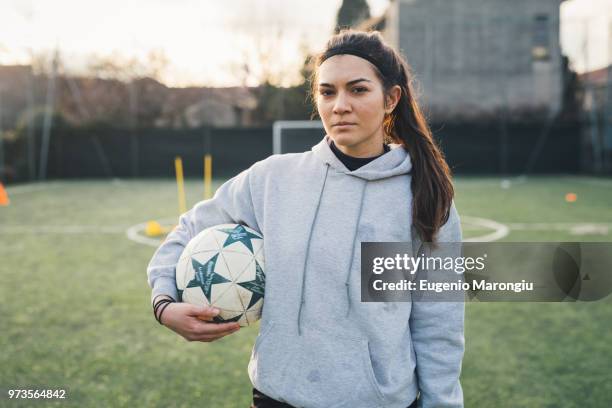 portrait of female football player - female soccer stock pictures, royalty-free photos & images