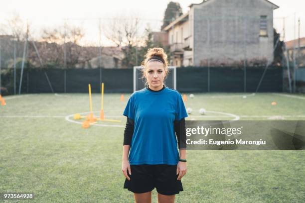 portrait of female football player - football tee stock pictures, royalty-free photos & images