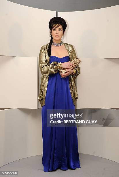 French actress Isabelle Adjani poses with her award of the best actress for her part in "La journee de la jupe" during a photocall as part of the the...