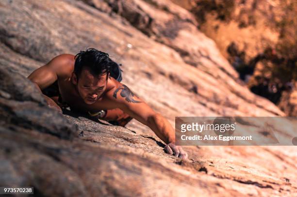 young man, sport climbing, overhead view, skaha bluffs provincial park, penticton, canada - penticton stock pictures, royalty-free photos & images