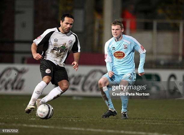 Billy McKay of Northampton Town looks for the ball with Ryan Green of Hereford United during the Coca Cola League Two Match between Hereford United...