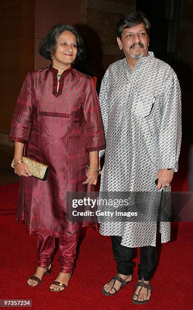 Bollywood actor/director Amol Palekar and his wife Chitra attend a party hosted by Indian businessman Anil Ambani and his actress wife Tina, February...