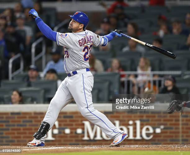 First baseman Adrian Gonzalez of the New York Mets swings during the game against the Atlanta Braves at SunTrust Park on April 21, 2018 in Atlanta,...
