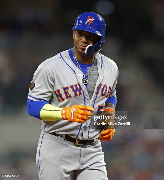 Left fielder Yoenis Cespedes of the New York Mets grins while running during the game against the Atlanta Braves at SunTrust Park on April 21, 2018...
