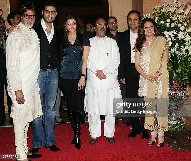 Bollywood actor Amitabh Bachchan, his actor son Abhishek Bachchan and his wife Aishwarya Rai , along with Indian politician Amar Singh attend a party...