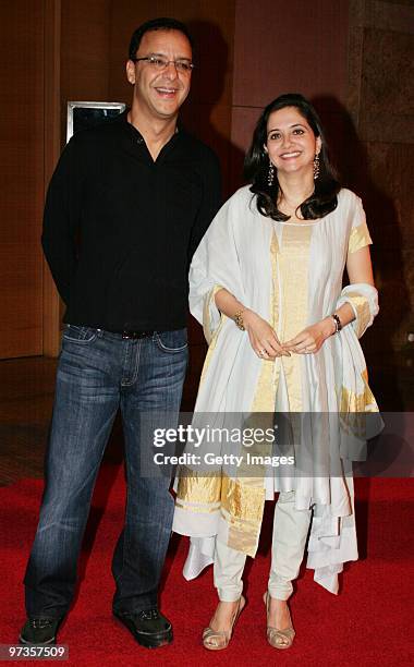 Bollywood filmmaker Vidhu Vinod Chopra and his wife Anupama attend a party hosted by Indian businessman Anil Ambani and his actress wife Tina,...