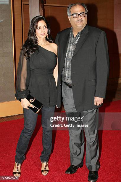 Bollywood actress Sridevi and her filmmaker husband Boney Kapoor attend a party hosted by Indian businessman Anil Ambani and his actress wife Tina,...