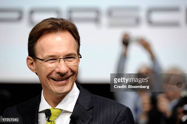 Michael Macht, chief executive officer of Porsche SE, reacts on the first press day of the Geneva International Motor Show in Geneva, Switzerland, on...