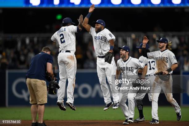 Jose Pirela, Manuel Margot, Matt Szczur and Travis Jankowski of the San Diego Padres celebrate after the final out during the game against the...