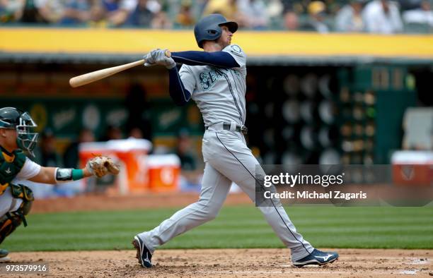 Andrew Romine of the Seattle Mariners bats during the game against the Oakland Athletics at the Oakland Alameda Coliseum on May 24, 2018 in Oakland,...